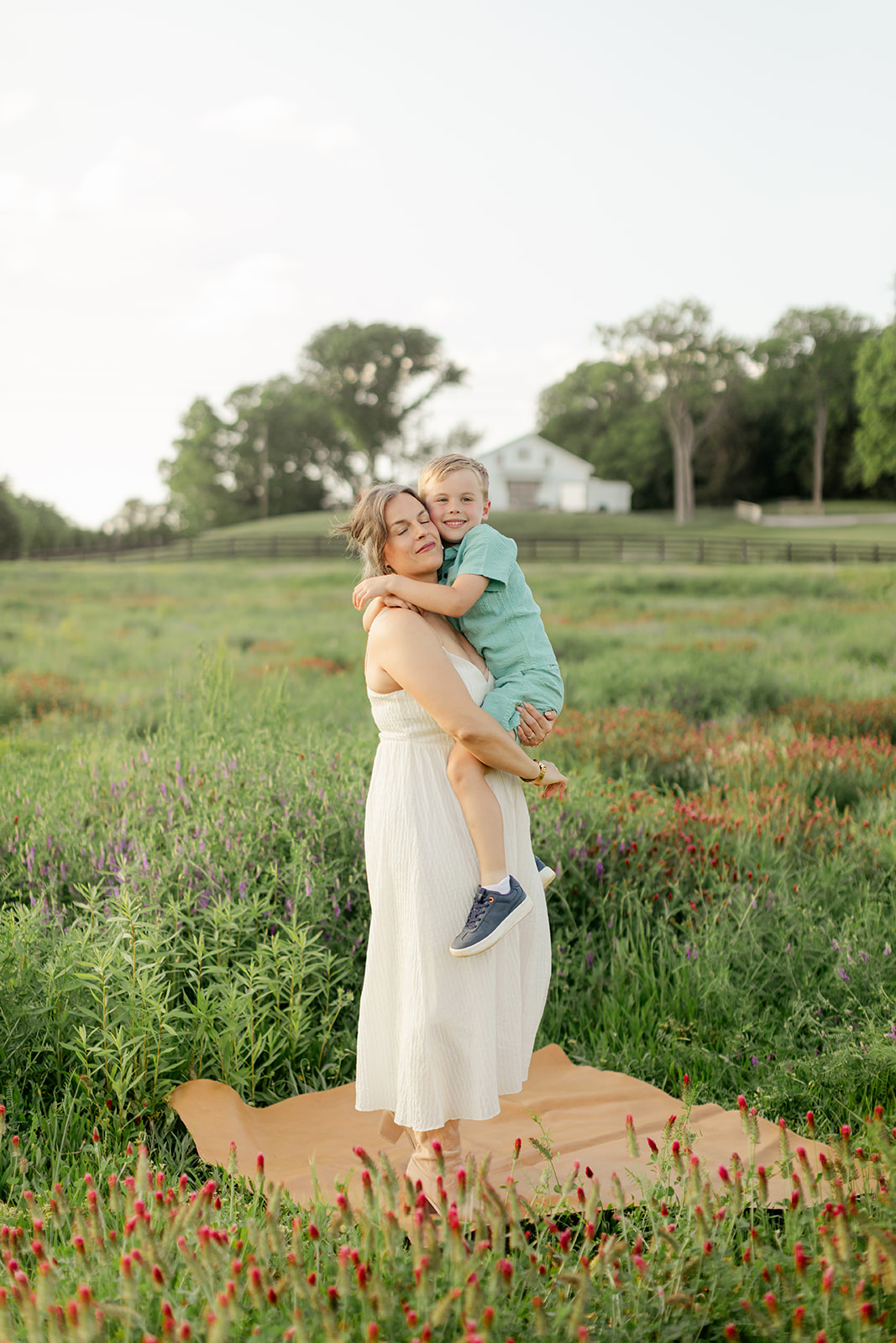 mother and son. Outdoor photo session in green field.