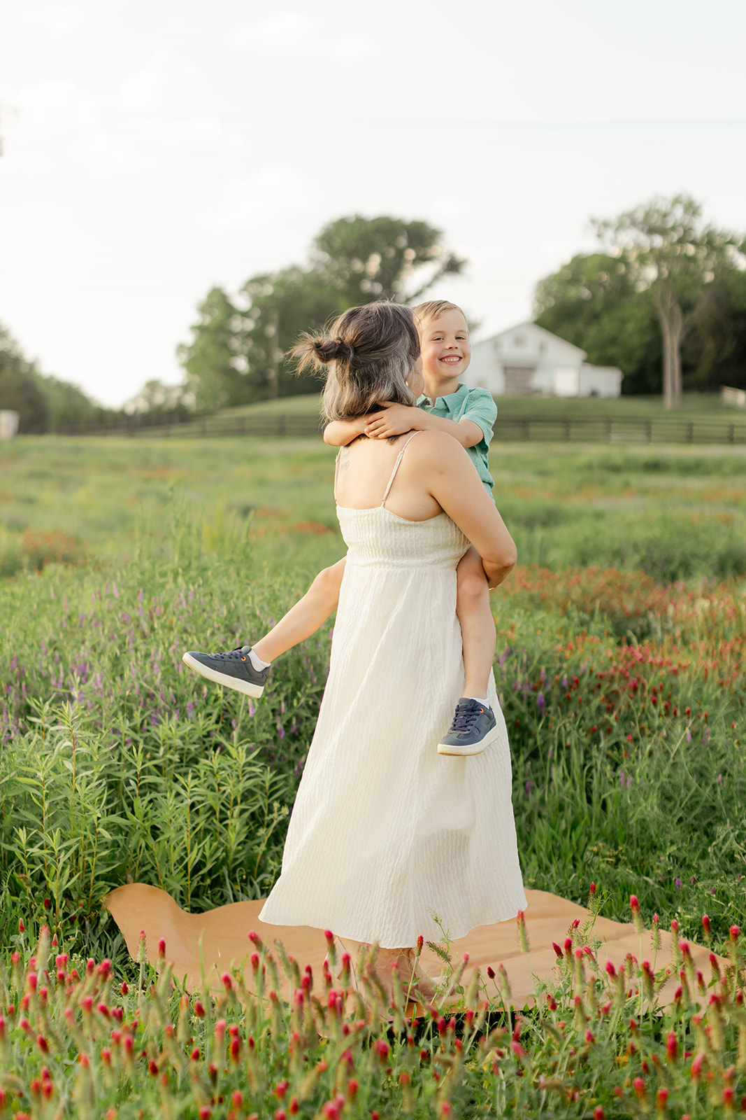 mother and son. Outdoor photo session in green field.