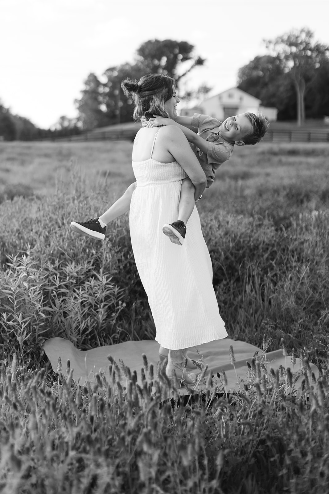 mother and son. Outdoor photo session in green field.