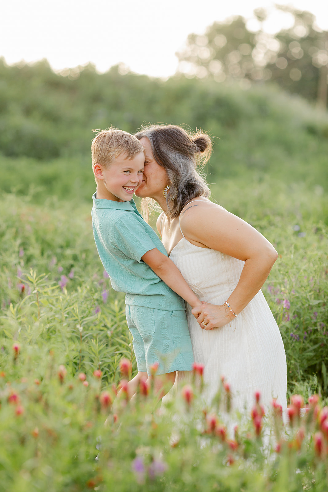 mother and son. Outdoor photo session in green field.
