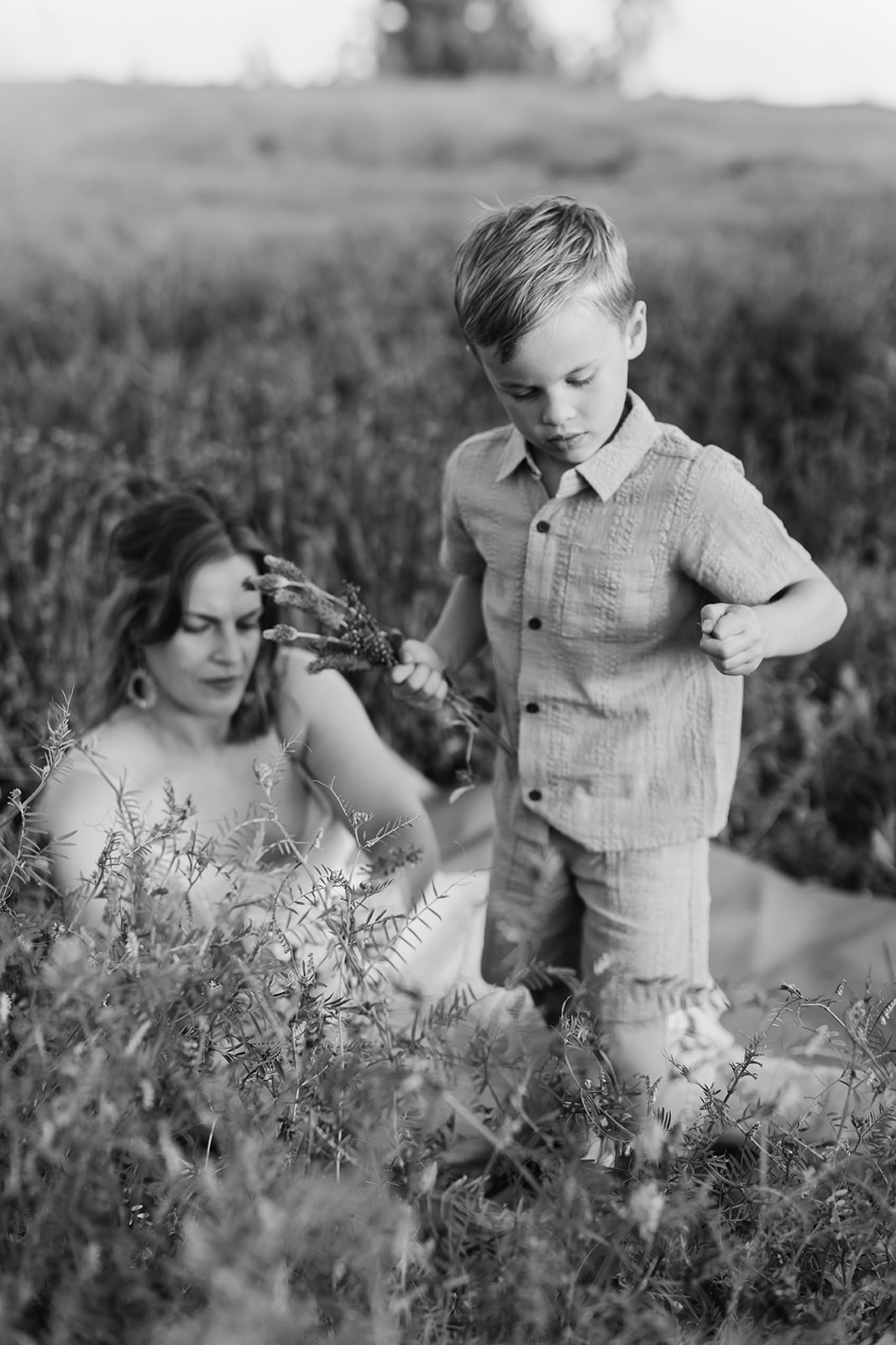 mother and son. Outdoor photo session in green field.