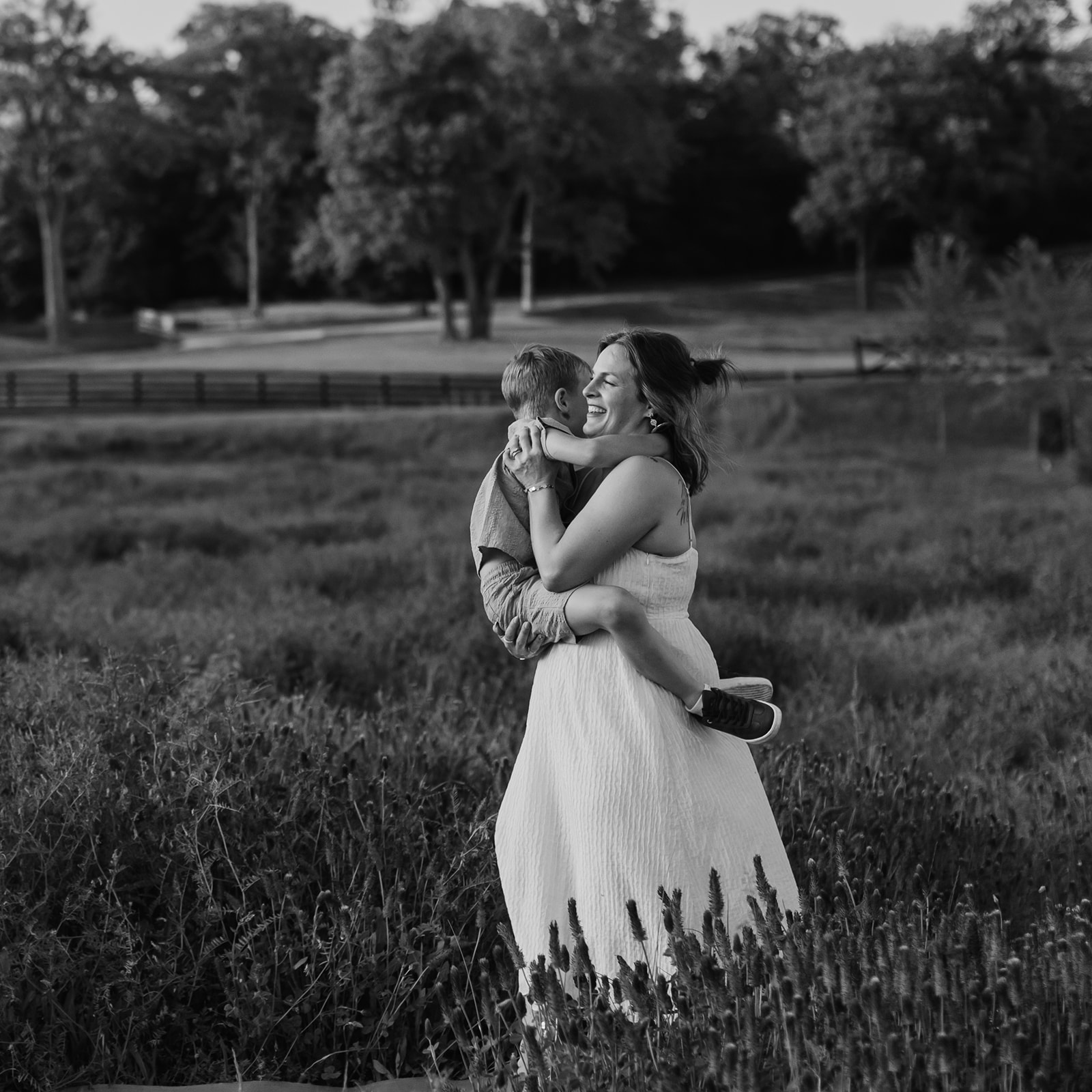mother and son. Outdoor photo session in green field.