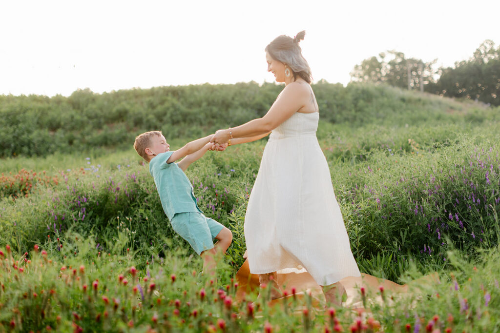 mama and so. Outdoor photo session in green field.