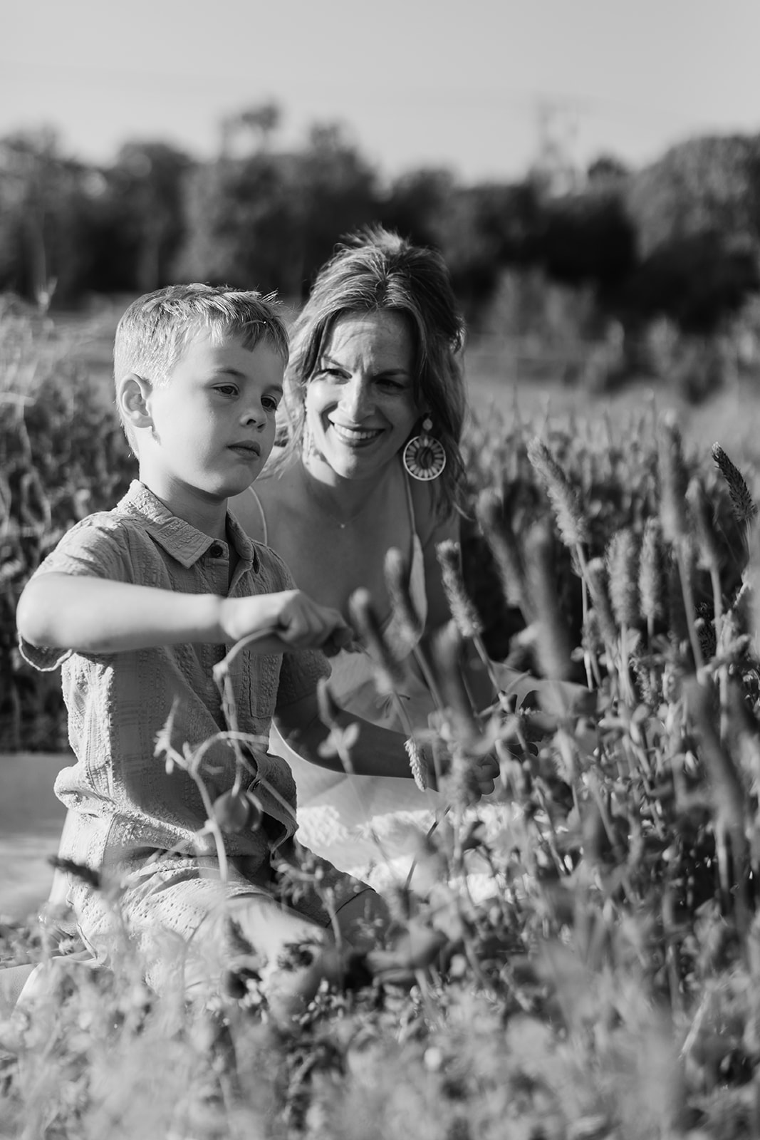 mother and son. Outdoor photo session in green field.