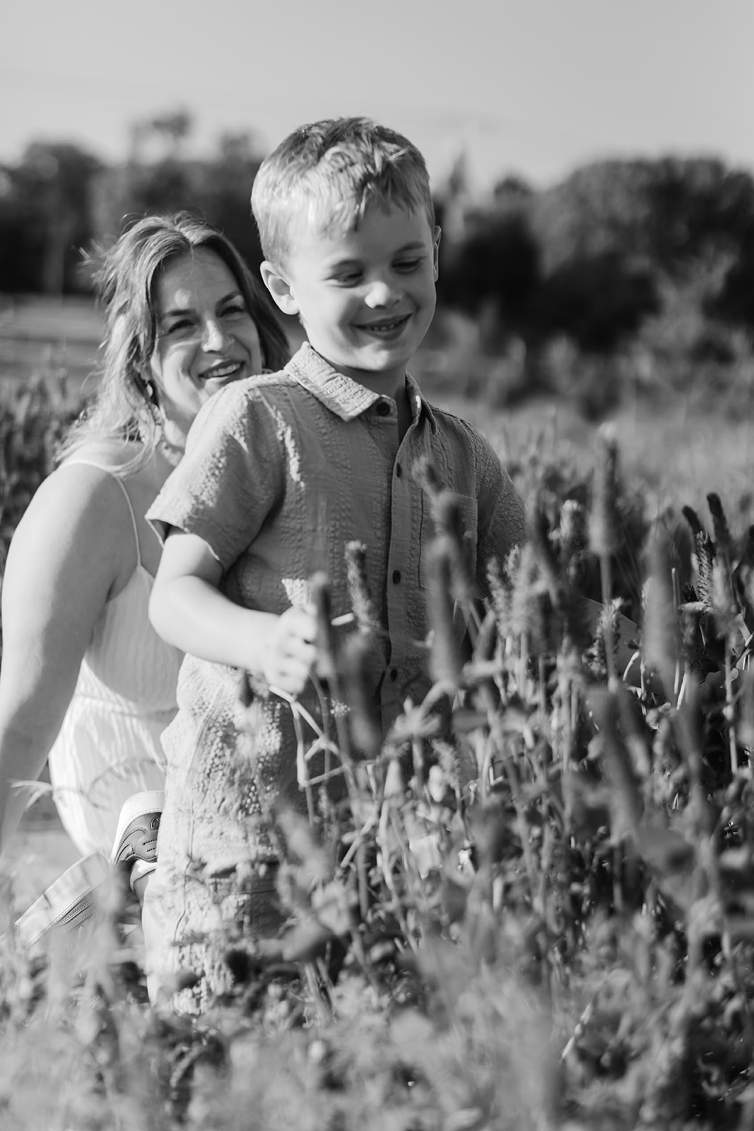 mother and son. Outdoor photo session in green field.