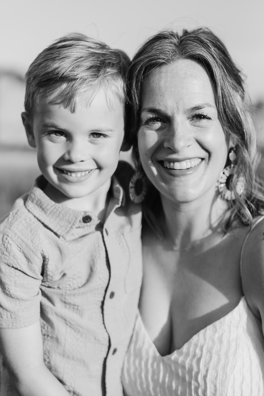mother and son. Outdoor photo session in green field.